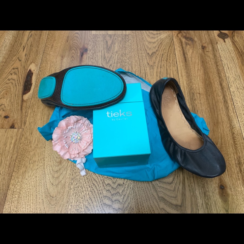 Matte Black Tieks with box, bag, and flower.